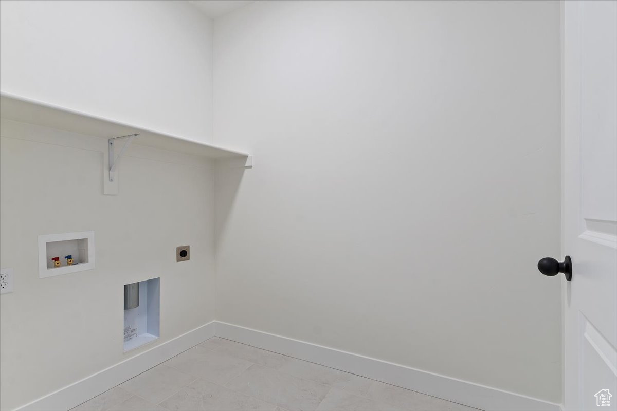 Laundry room featuring hookup for a washing machine and hookup for an electric dryer