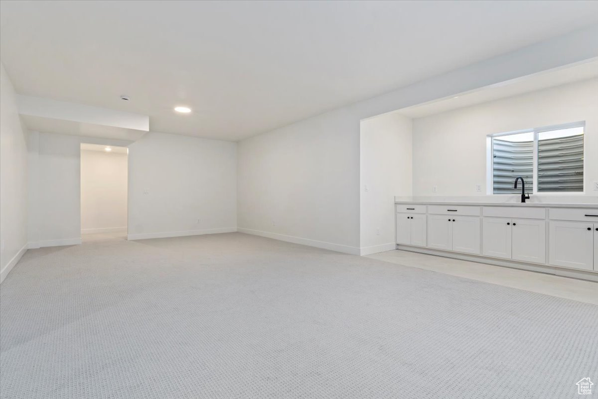 Basement rec room with tiled breakfast bar area