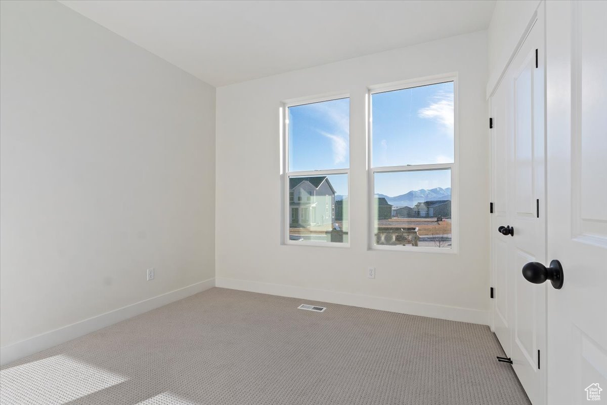 Main floor bedroom with a mountain view