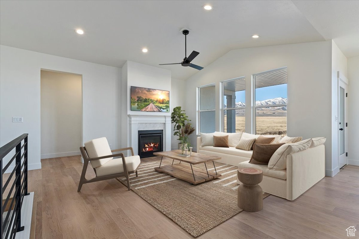 Living room with a fireplace and vaulted ceiling