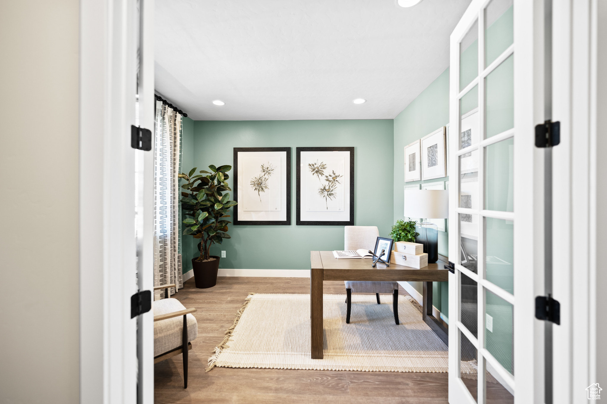 Office featuring wood-type flooring and french doors