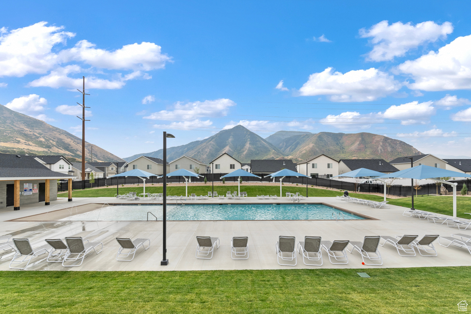 View of pool featuring a mountain view, a yard, and a patio