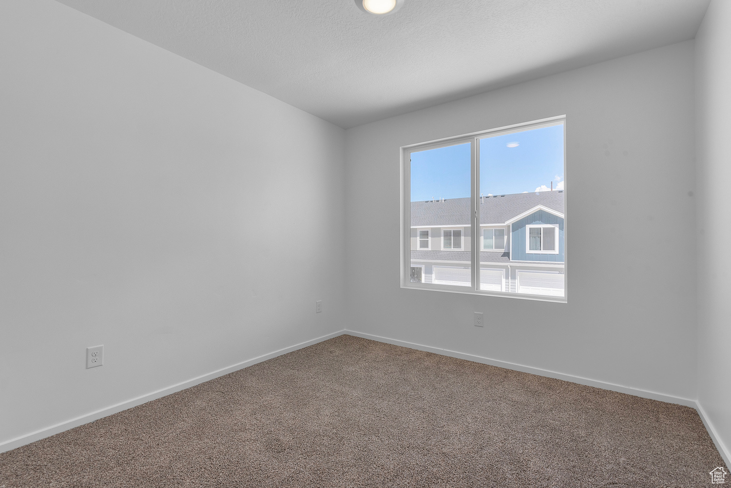 Secondary bedroom with carpet