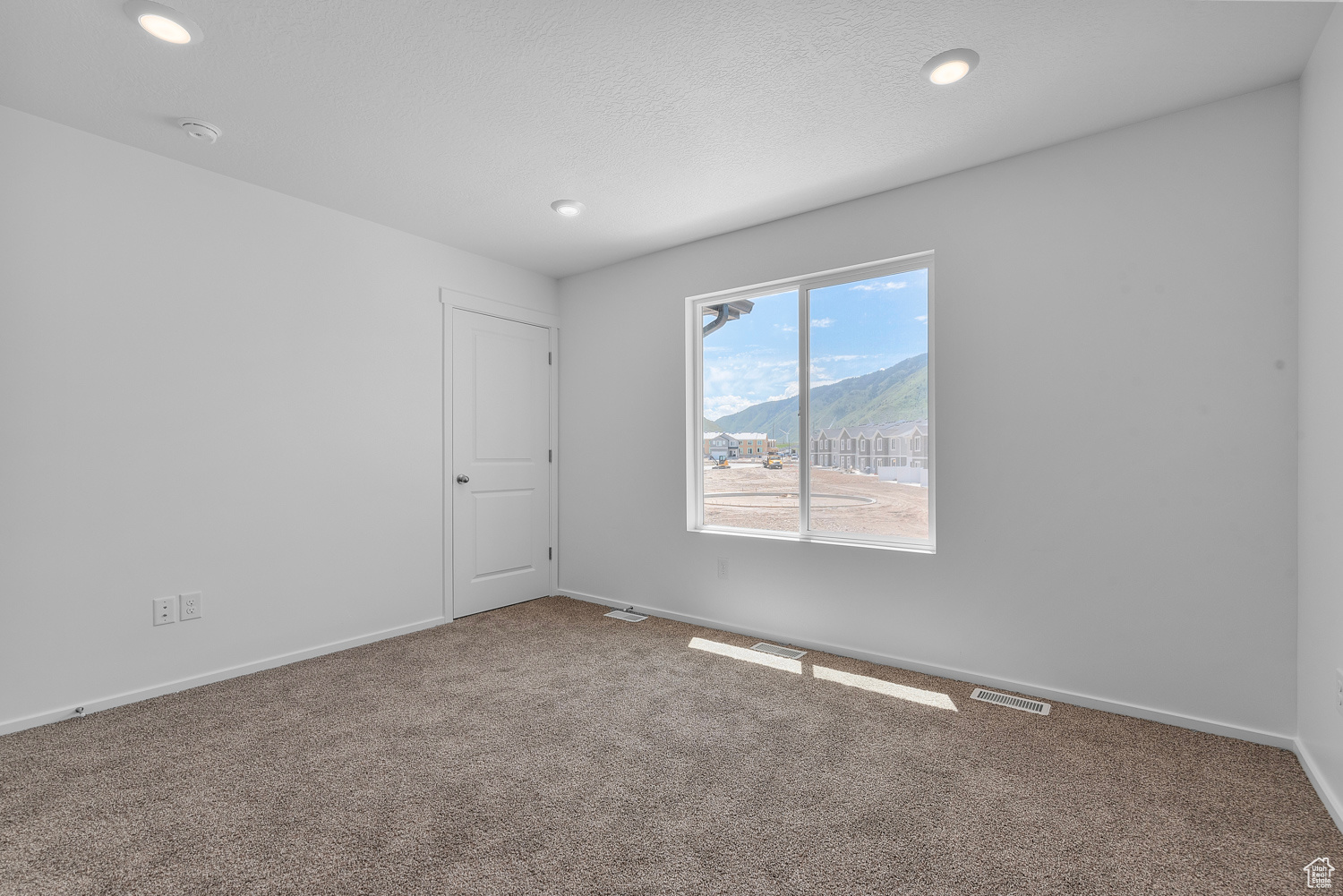 Primary bedroom featuring carpet