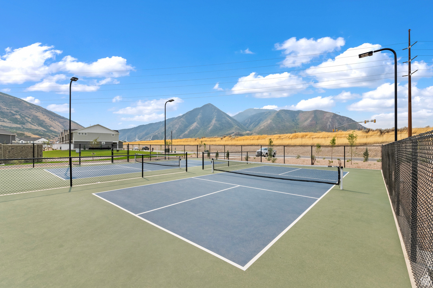 View of sport court with a mountain view