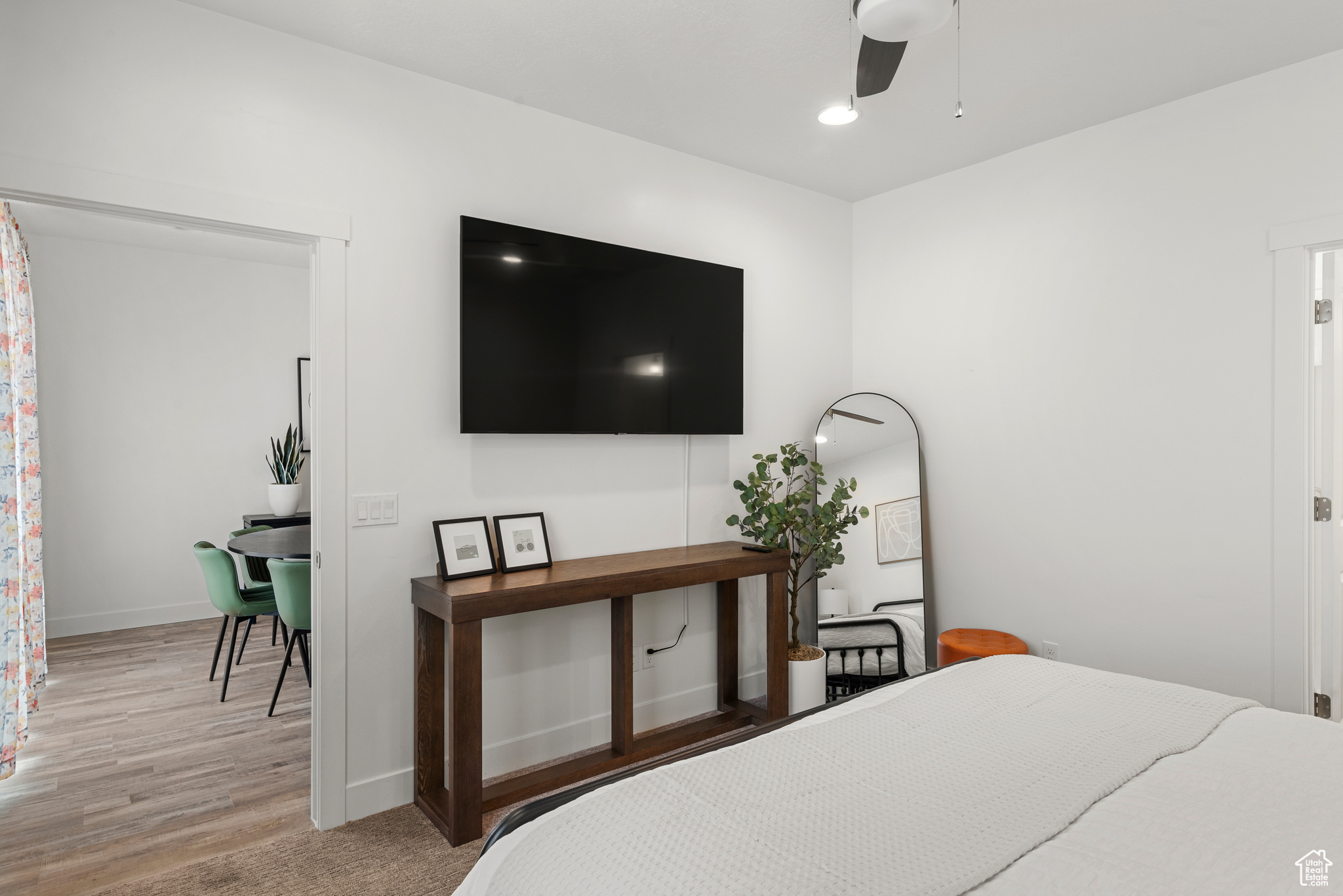 Bedroom featuring light hardwood / wood-style flooring and ceiling fan