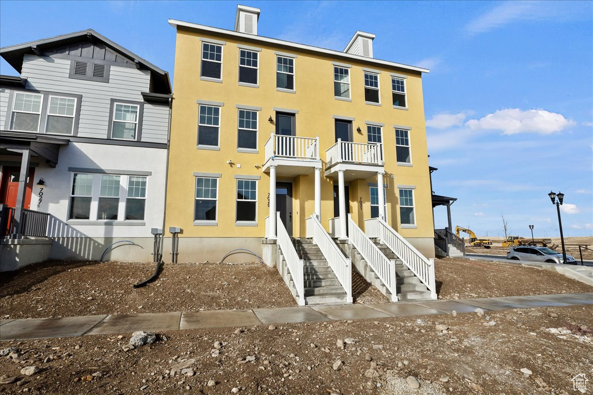 View of property with a balcony