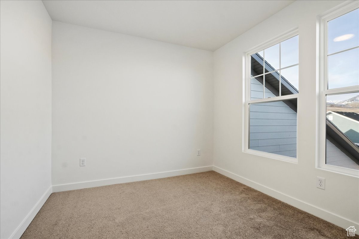 View of carpeted spare room