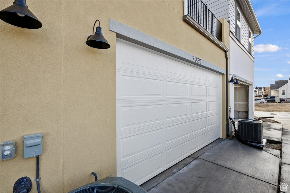 Garage featuring central air condition unit