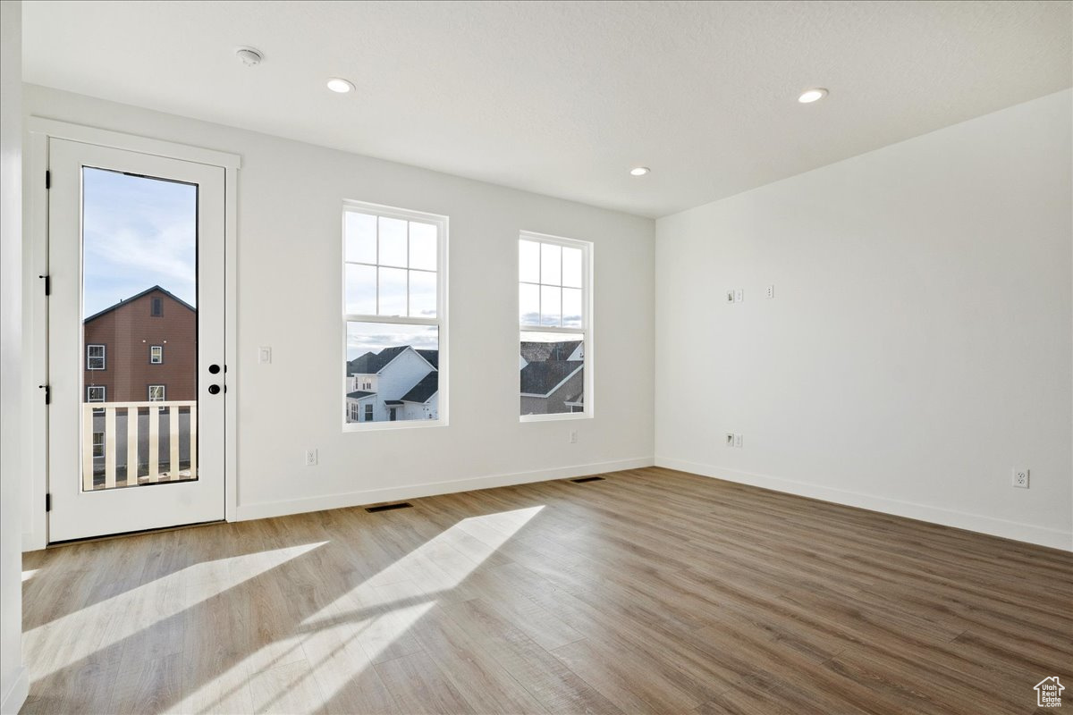 Spare room with light wood-type flooring