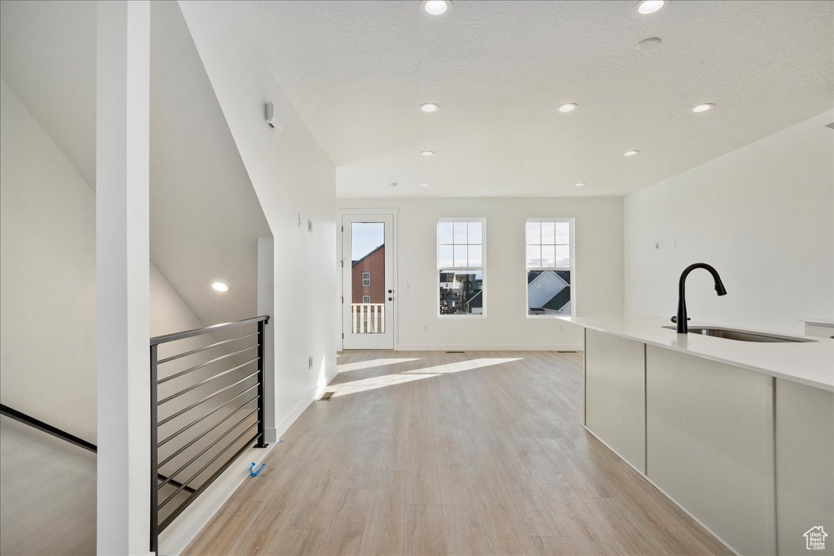 Interior space featuring sink and light hardwood / wood-style floors