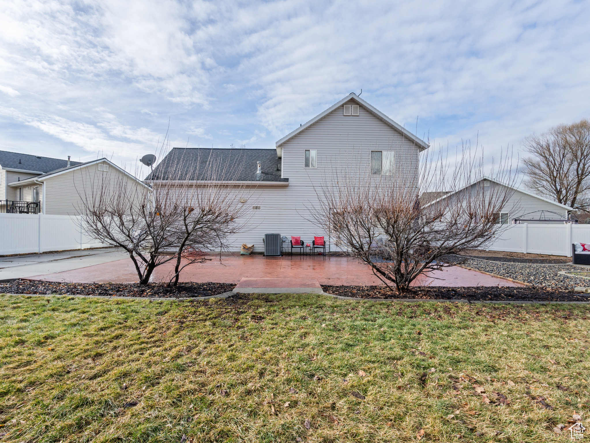 Exterior space featuring a lawn, a patio, and central AC