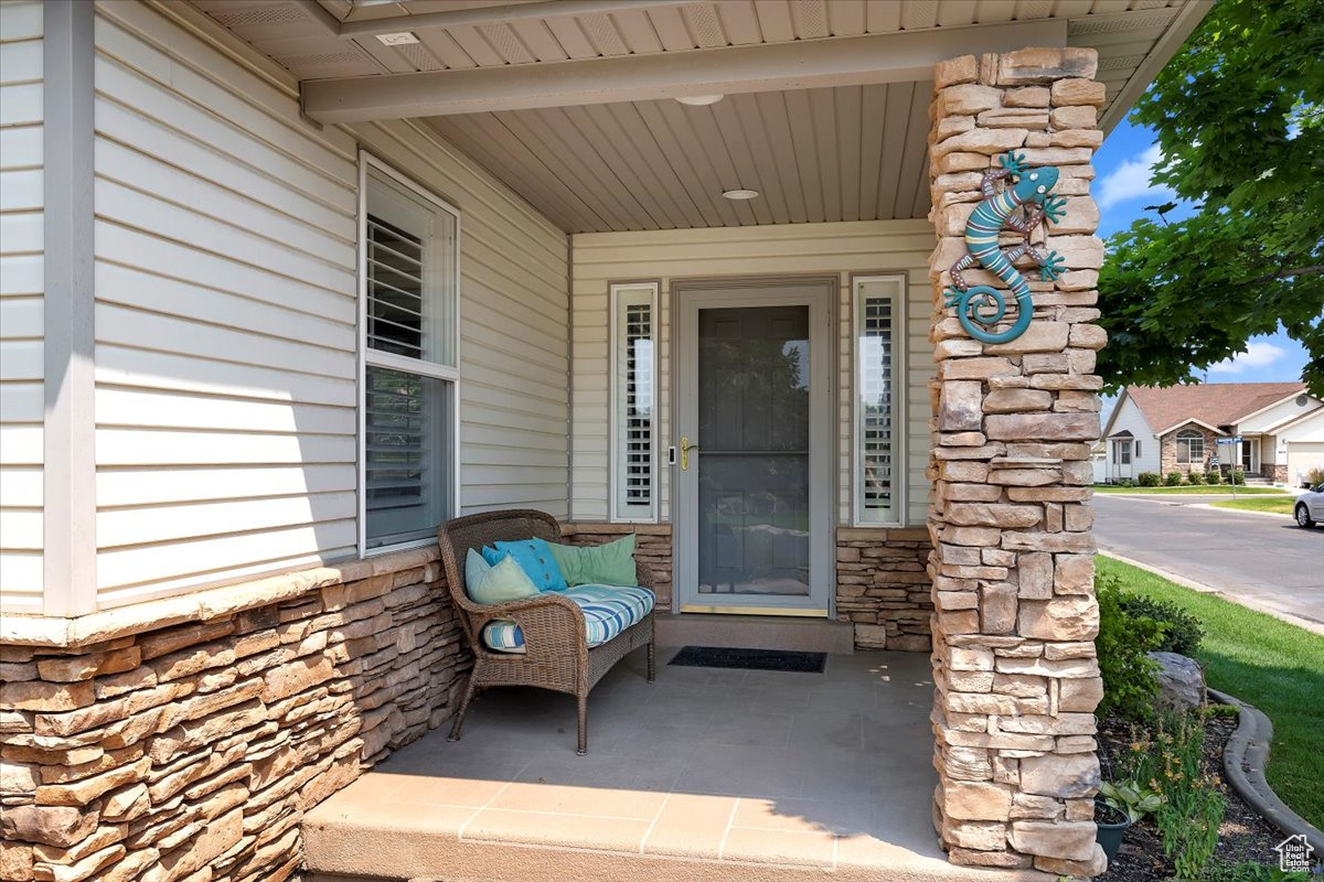 Front porch with sidelights and storm door.