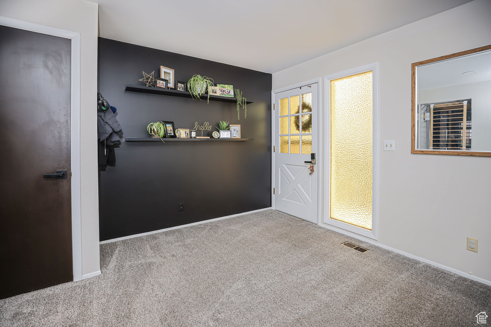 Interior space featuring light colored carpet