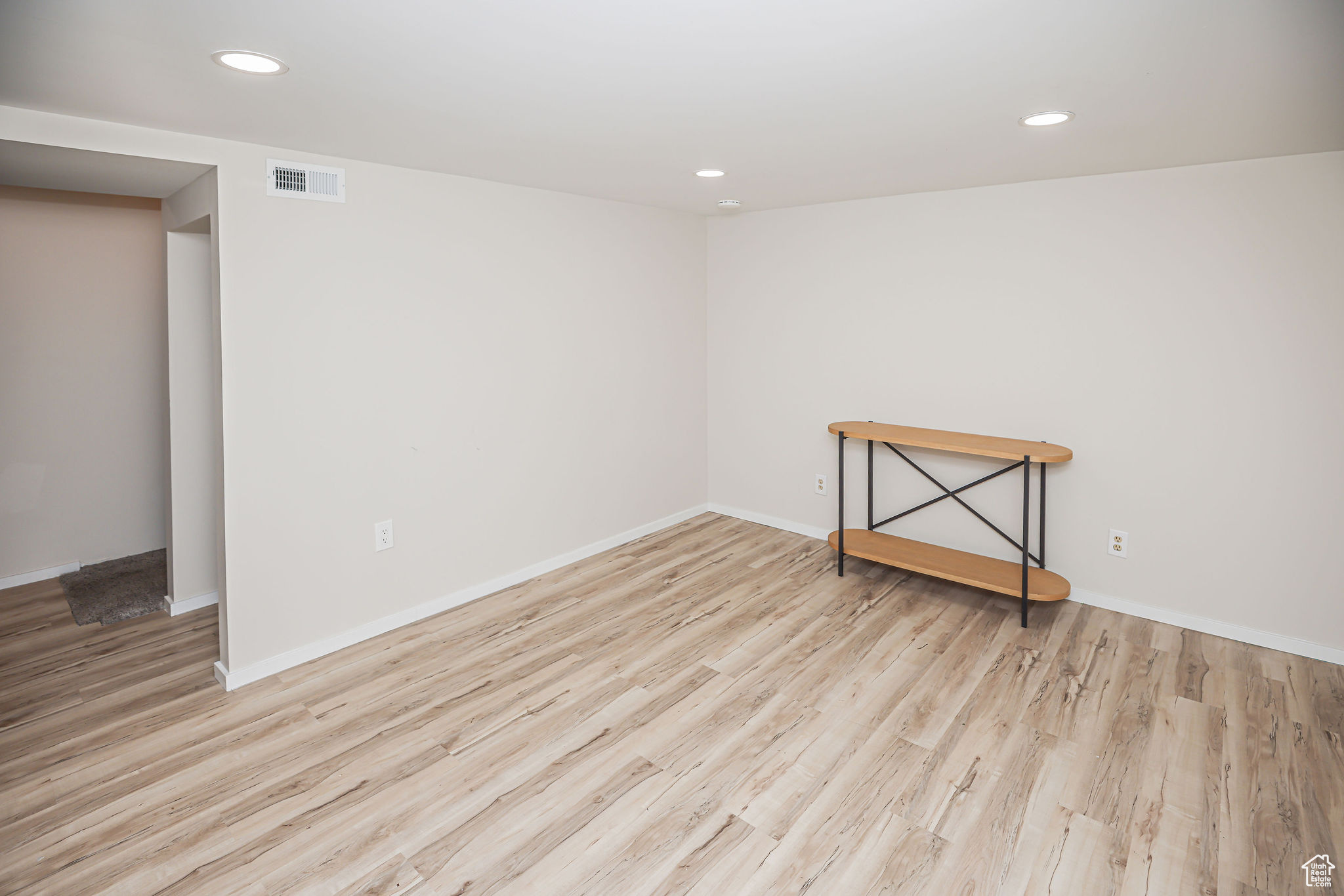 Unfurnished room with light hardwood / wood-style floors