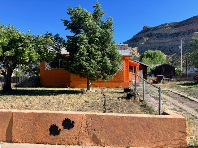 View of property exterior featuring a mountain view