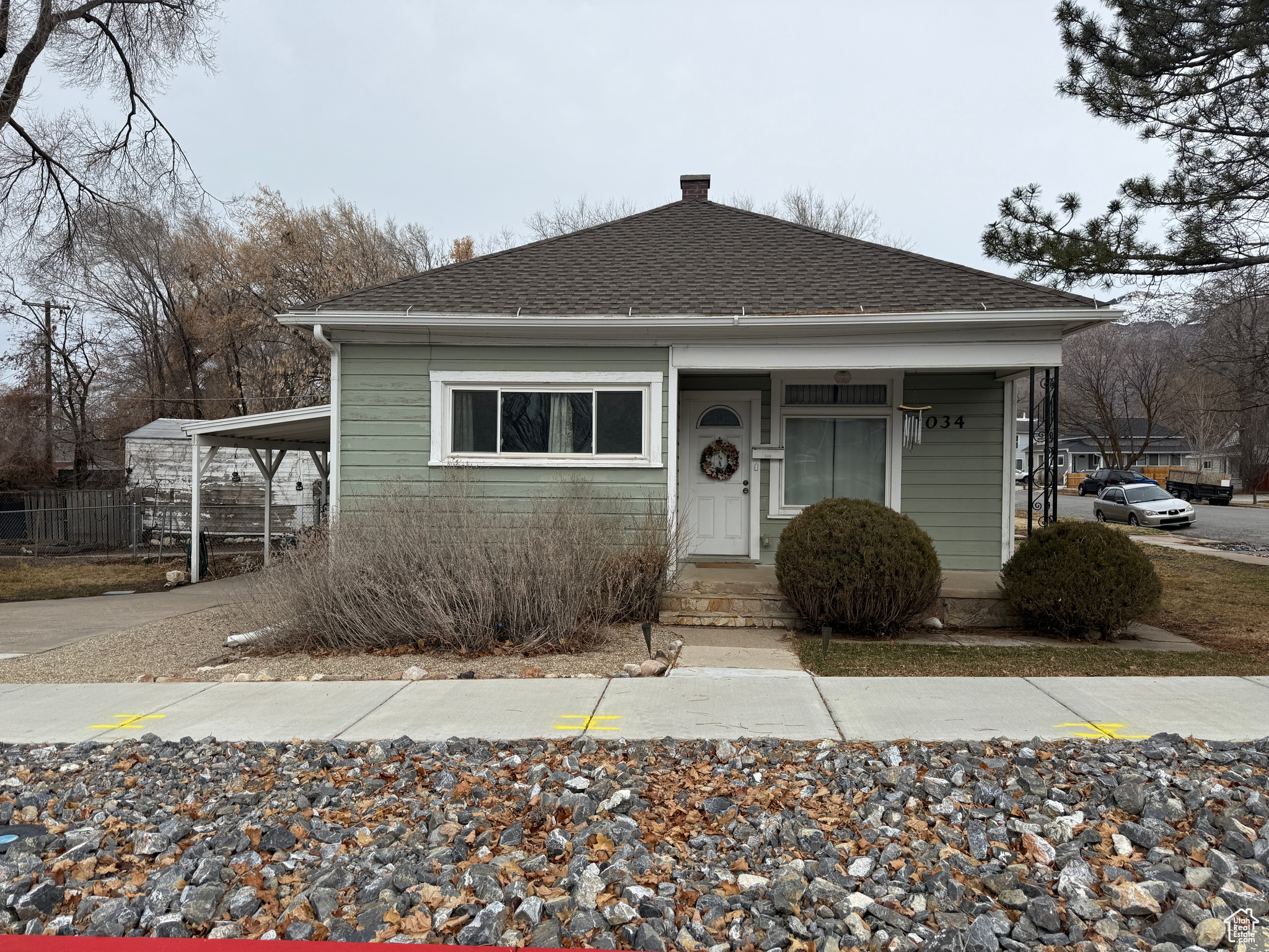 Bungalow featuring a carport