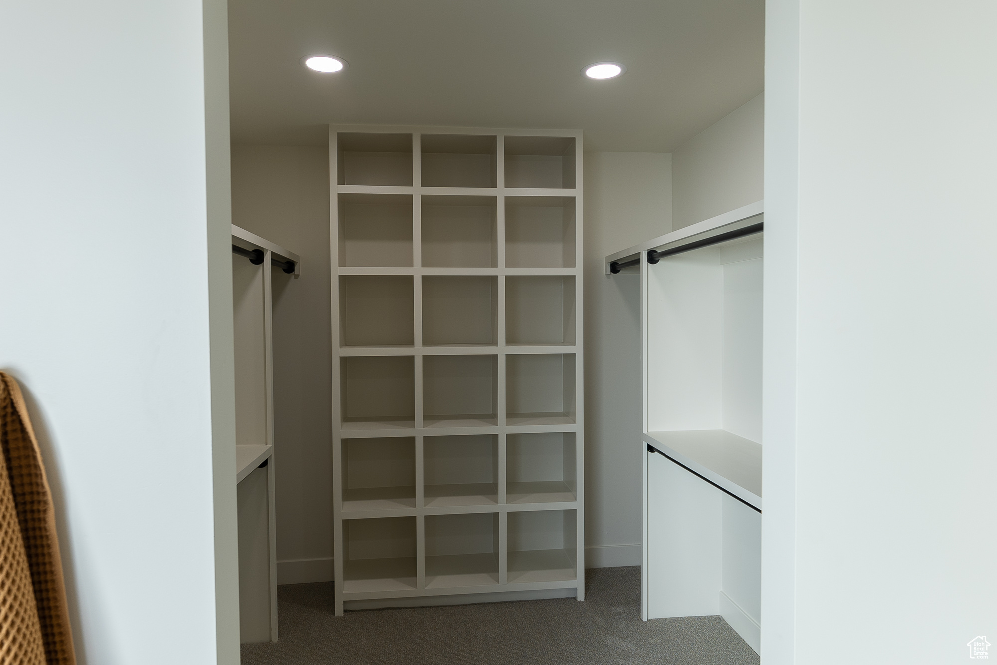 Spacious closet with carpet flooring