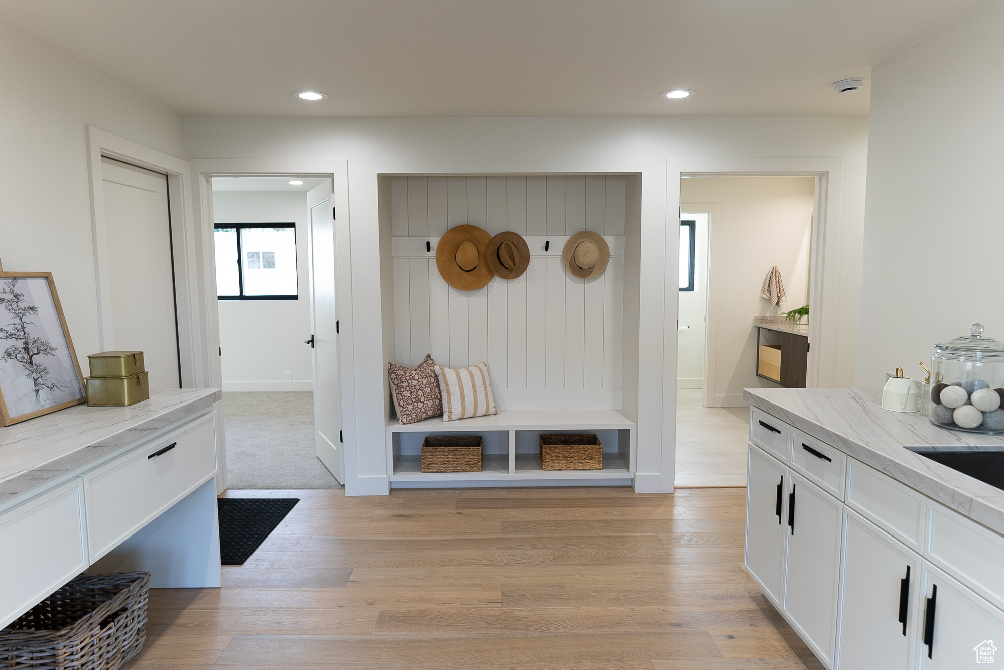 Mudroom with light hardwood / wood-style flooring