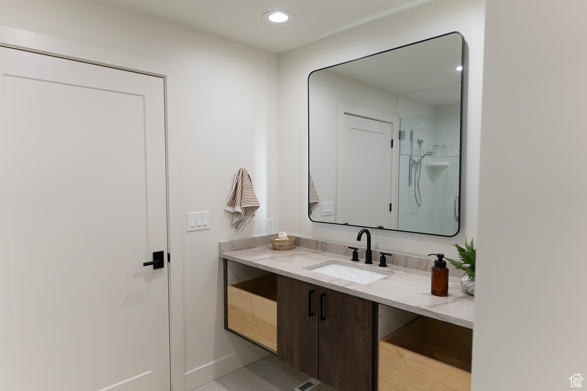 Bathroom with a shower and vanity