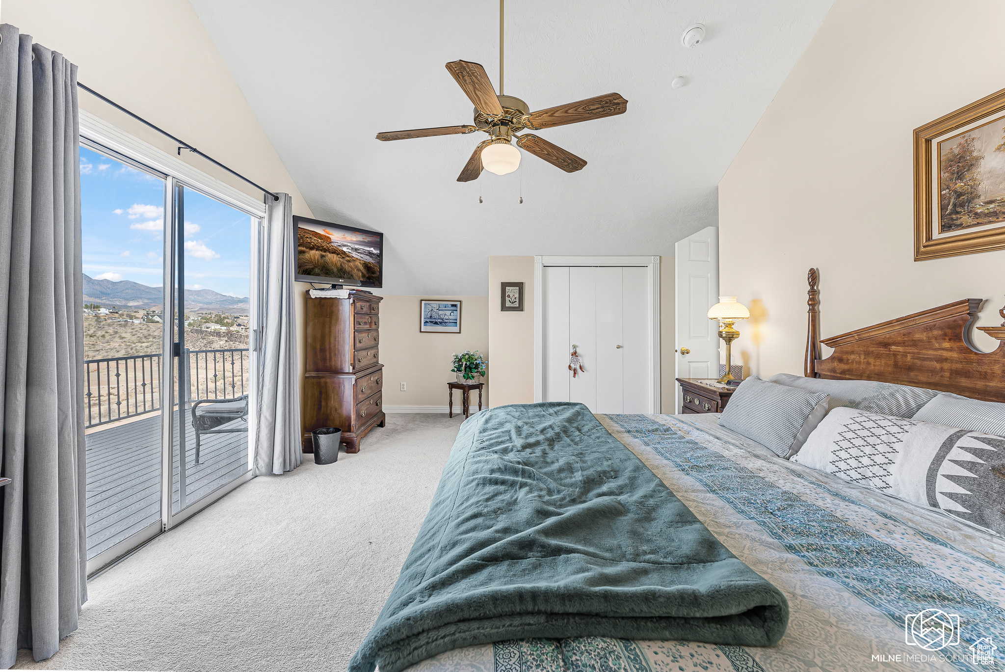 Bedroom with access to outside, ceiling fan, a closet, and lofted ceiling