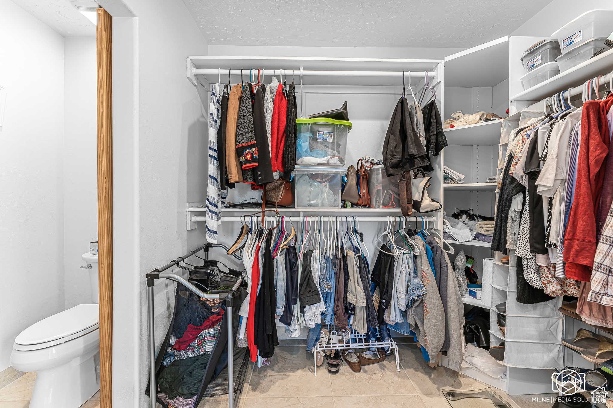 Walk in closet featuring tile patterned flooring