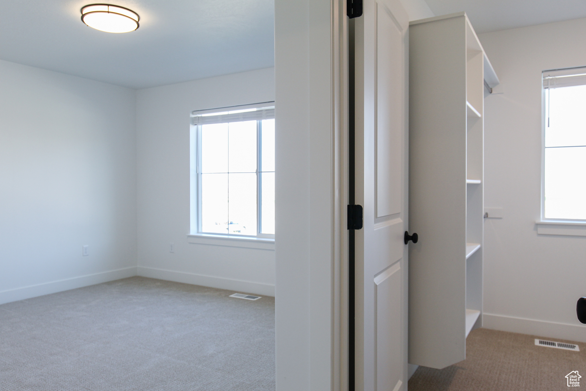 Interior space featuring light colored carpet