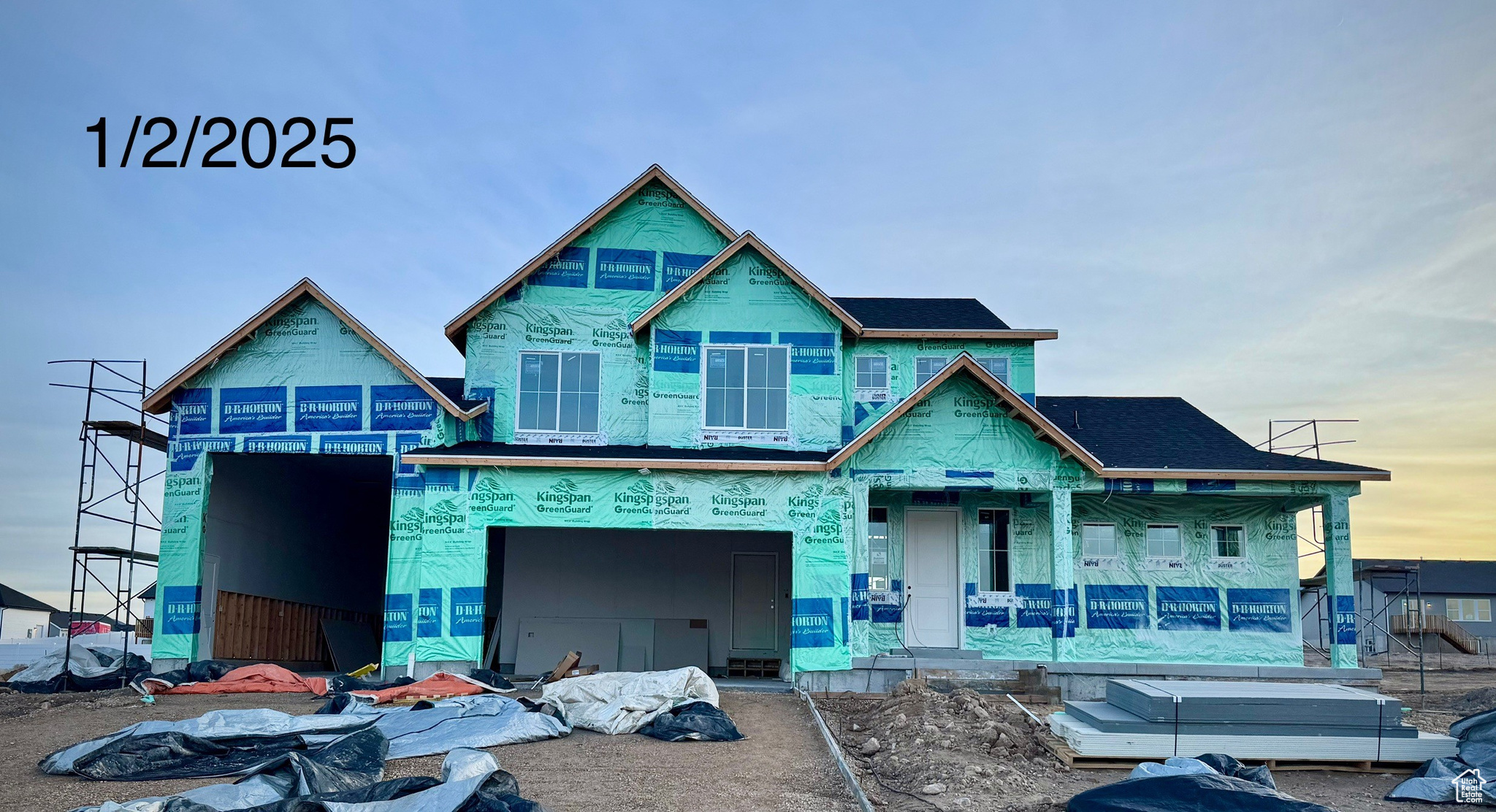 Property in mid-construction featuring covered porch