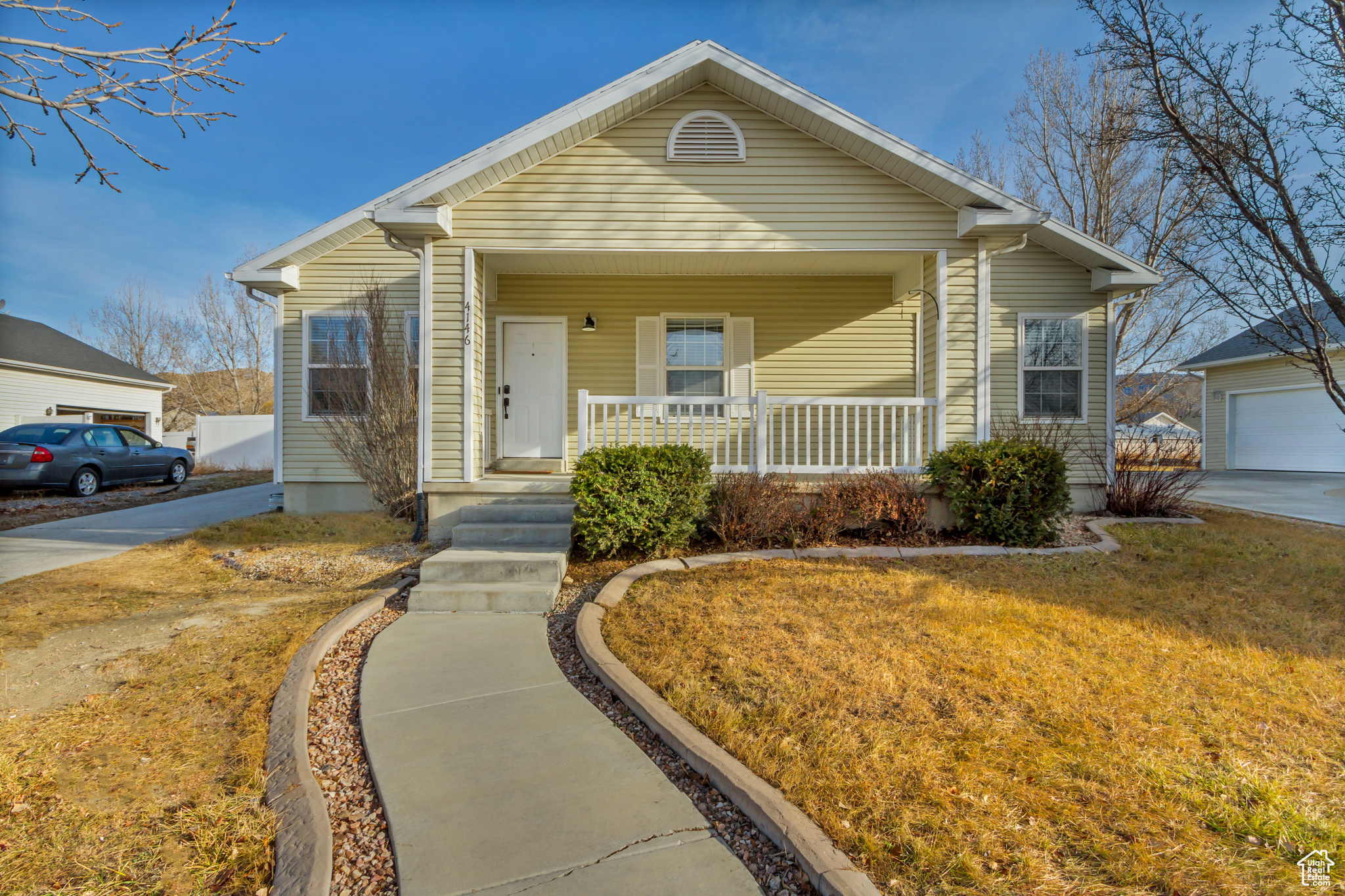 Bungalow featuring a porch and a front yard