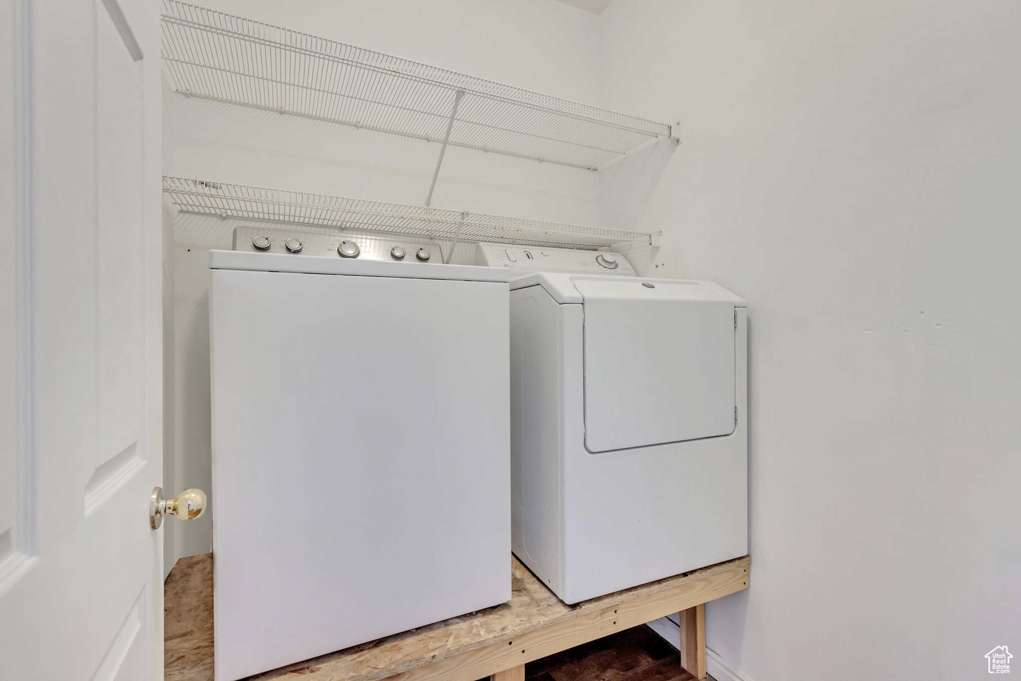 Laundry room featuring separate washer and dryer