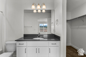 Bathroom with vanity and toilet