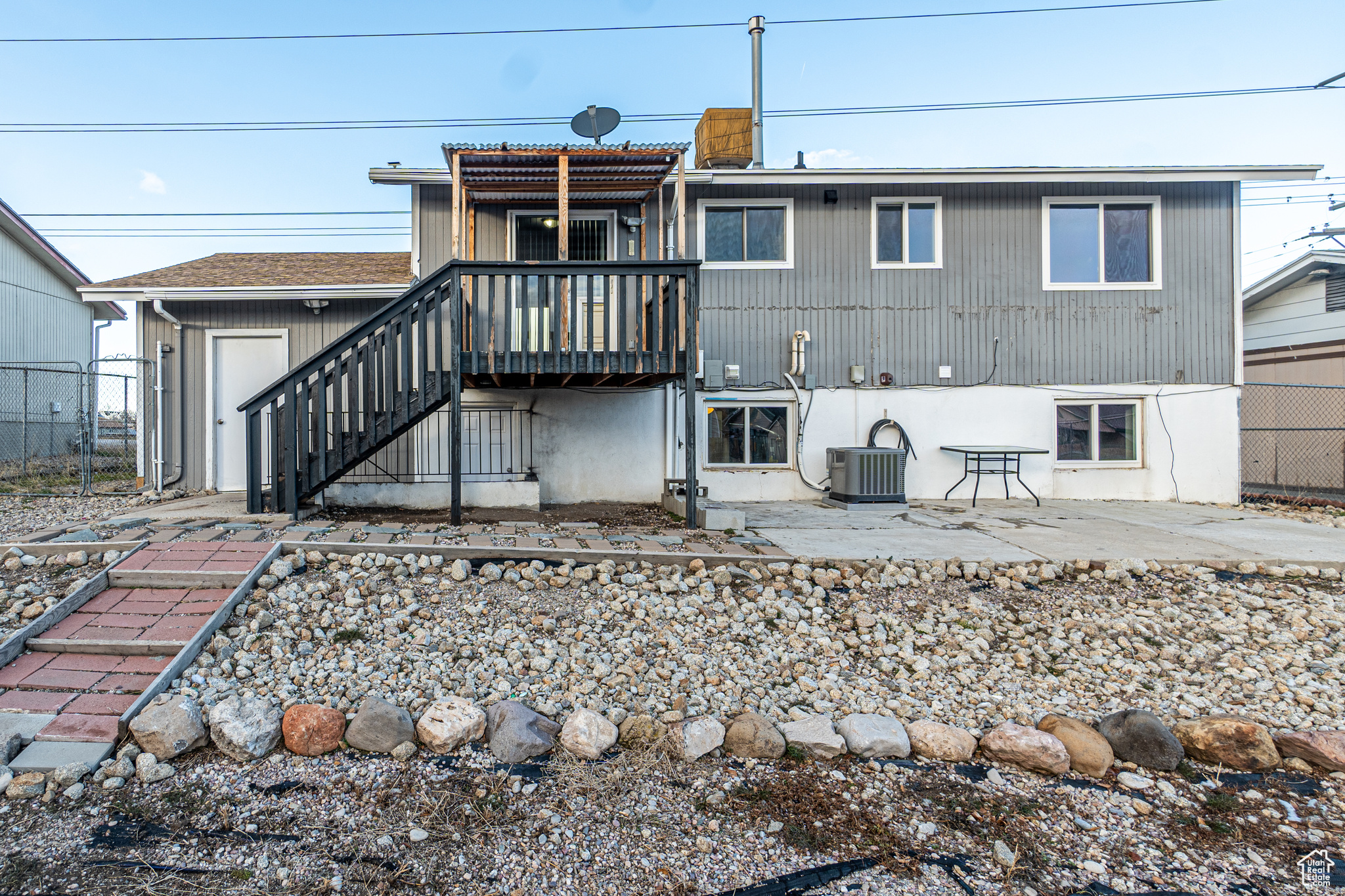 Rear view of property featuring cooling unit and a patio