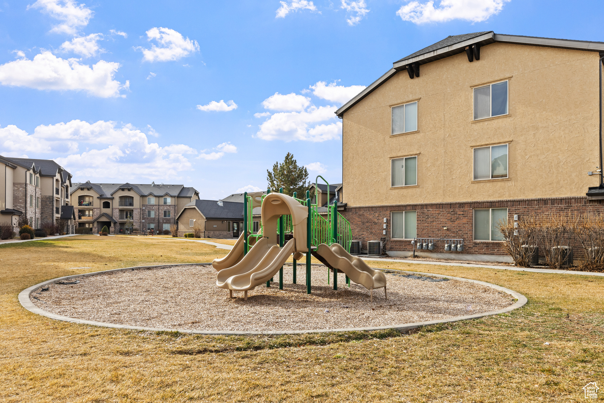 View of play area with a lawn