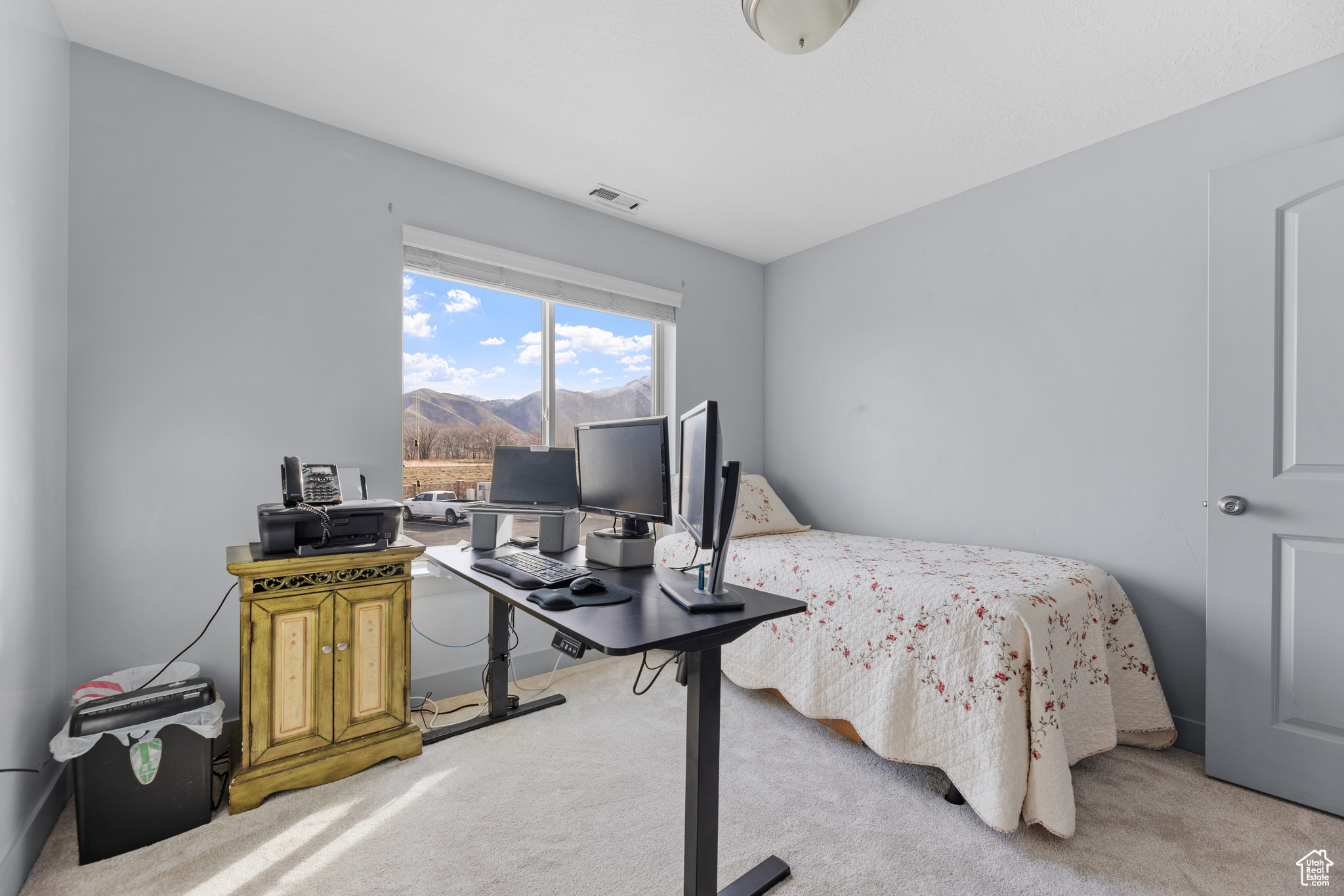 Bedroom with light colored carpet