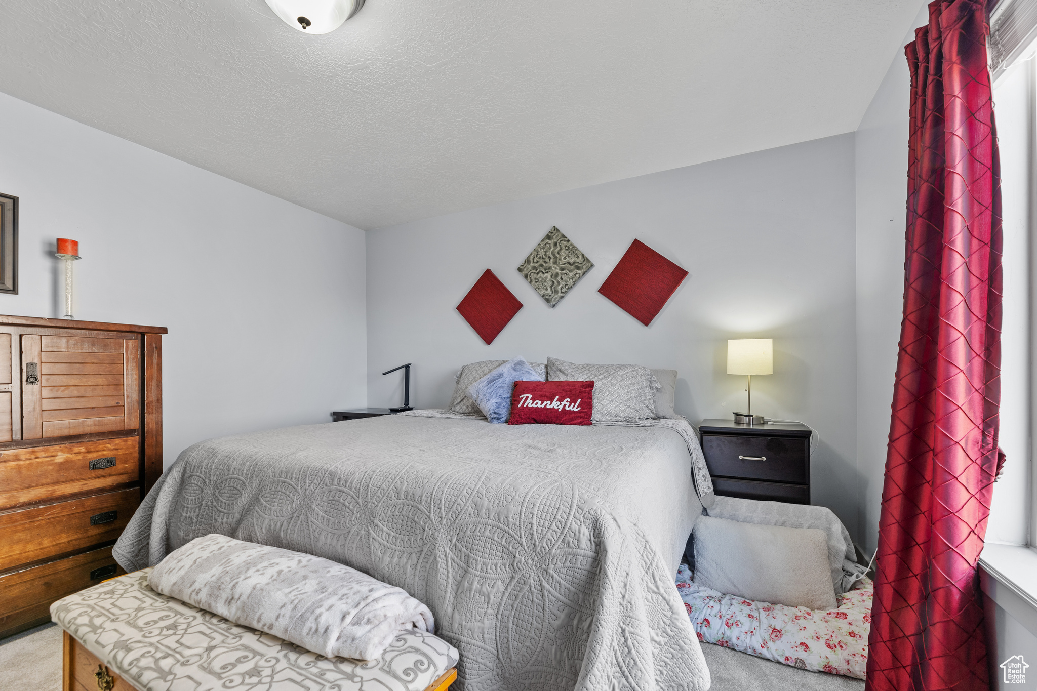 Bedroom featuring carpet flooring and multiple windows