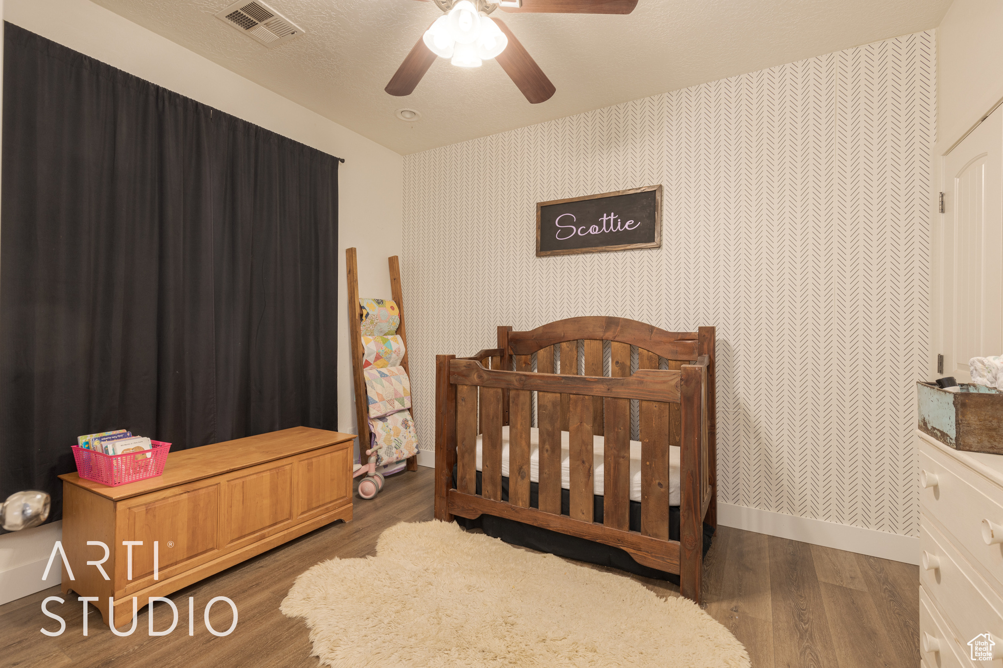 Bedroom featuring ceiling fan and dark hardwood / wood-style flooring