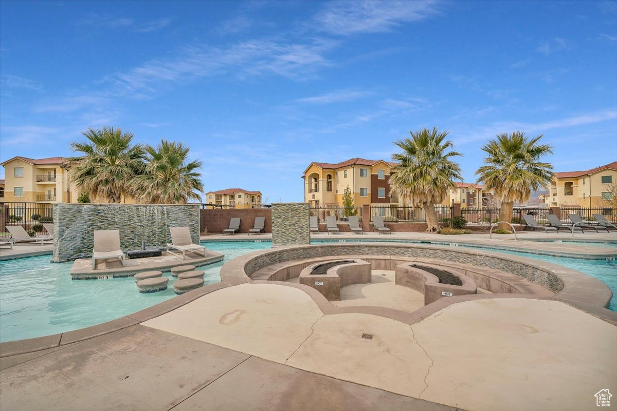 View of pool featuring a jacuzzi