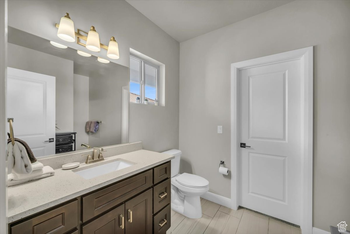 Bathroom featuring vanity and toilet