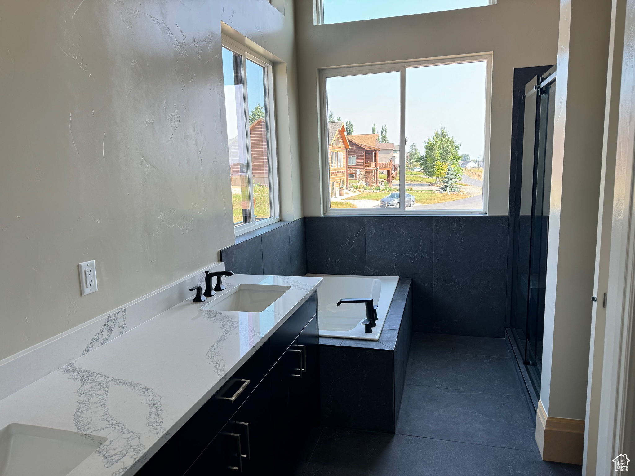 Bathroom with vanity and a tub