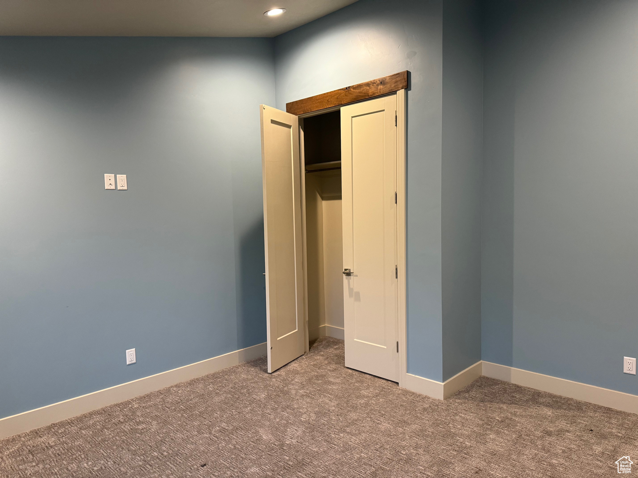 Unfurnished bedroom featuring carpet flooring