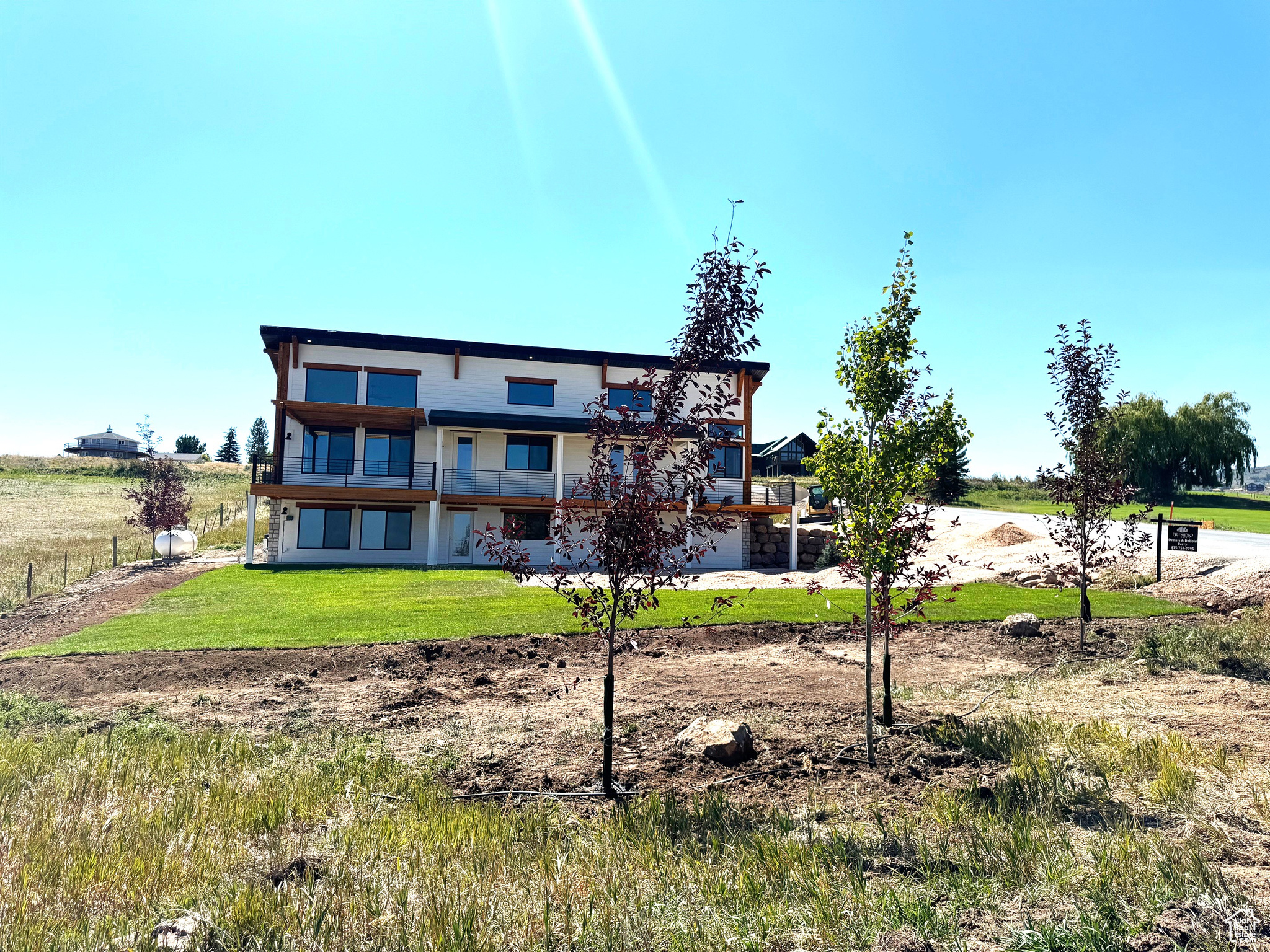 Rear view of property featuring a yard