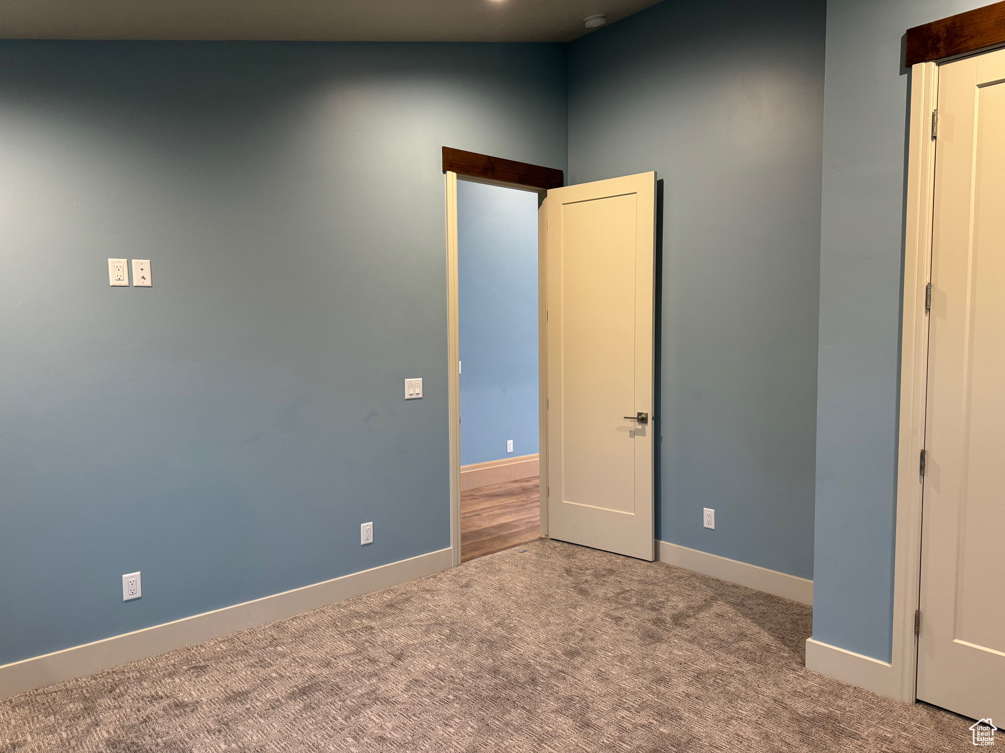 Unfurnished bedroom featuring carpet floors