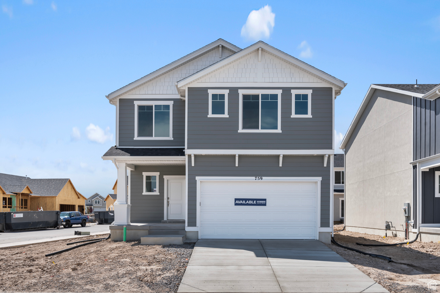 View of front of property featuring a garage