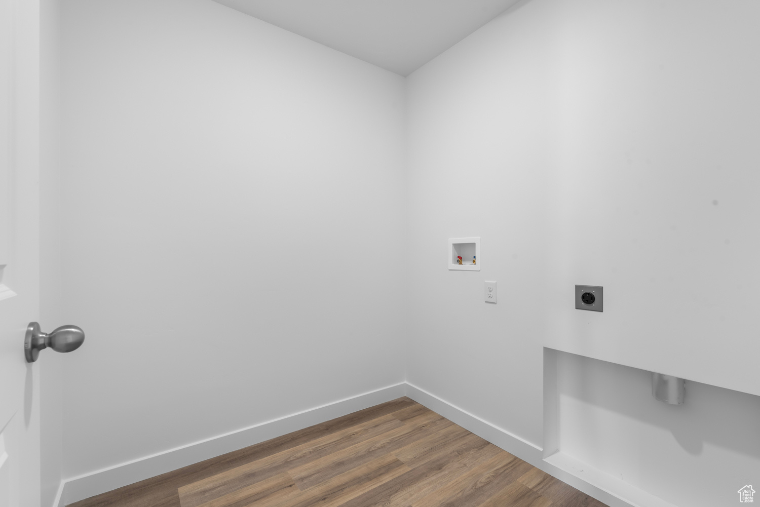 Laundry room featuring hookup for an electric dryer, dark hardwood / wood-style flooring, and washer hookup