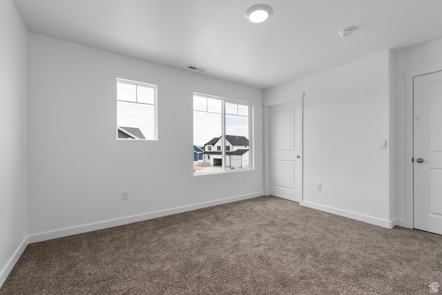 View of carpeted spare room