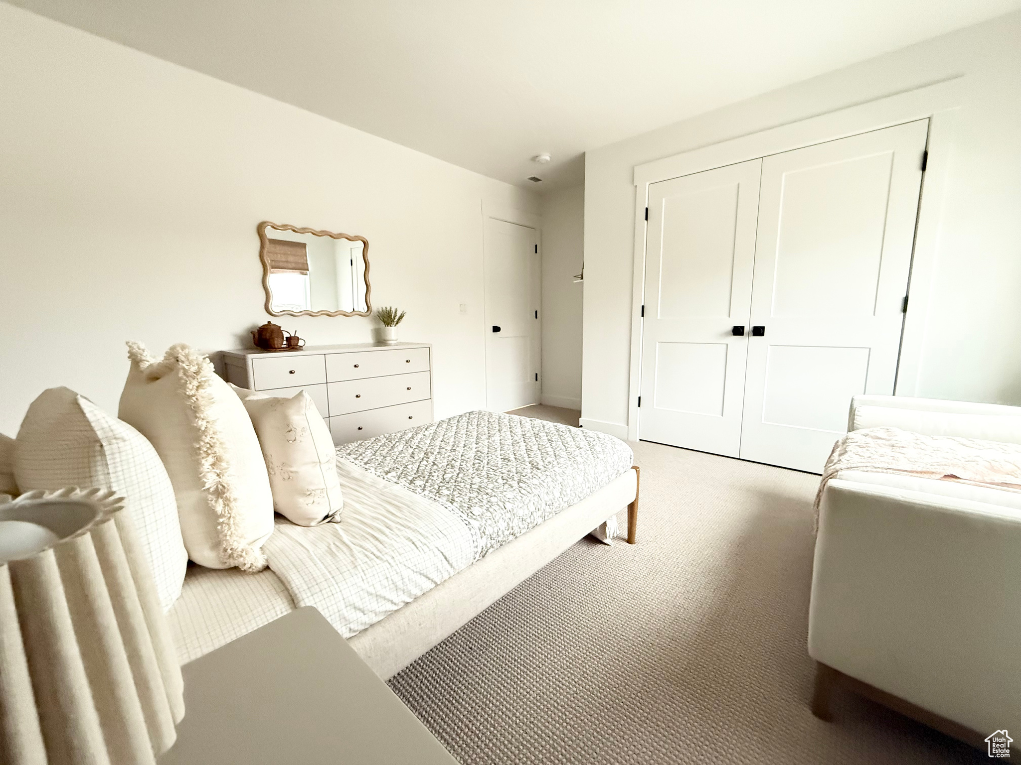 Bedroom with carpet and a closet