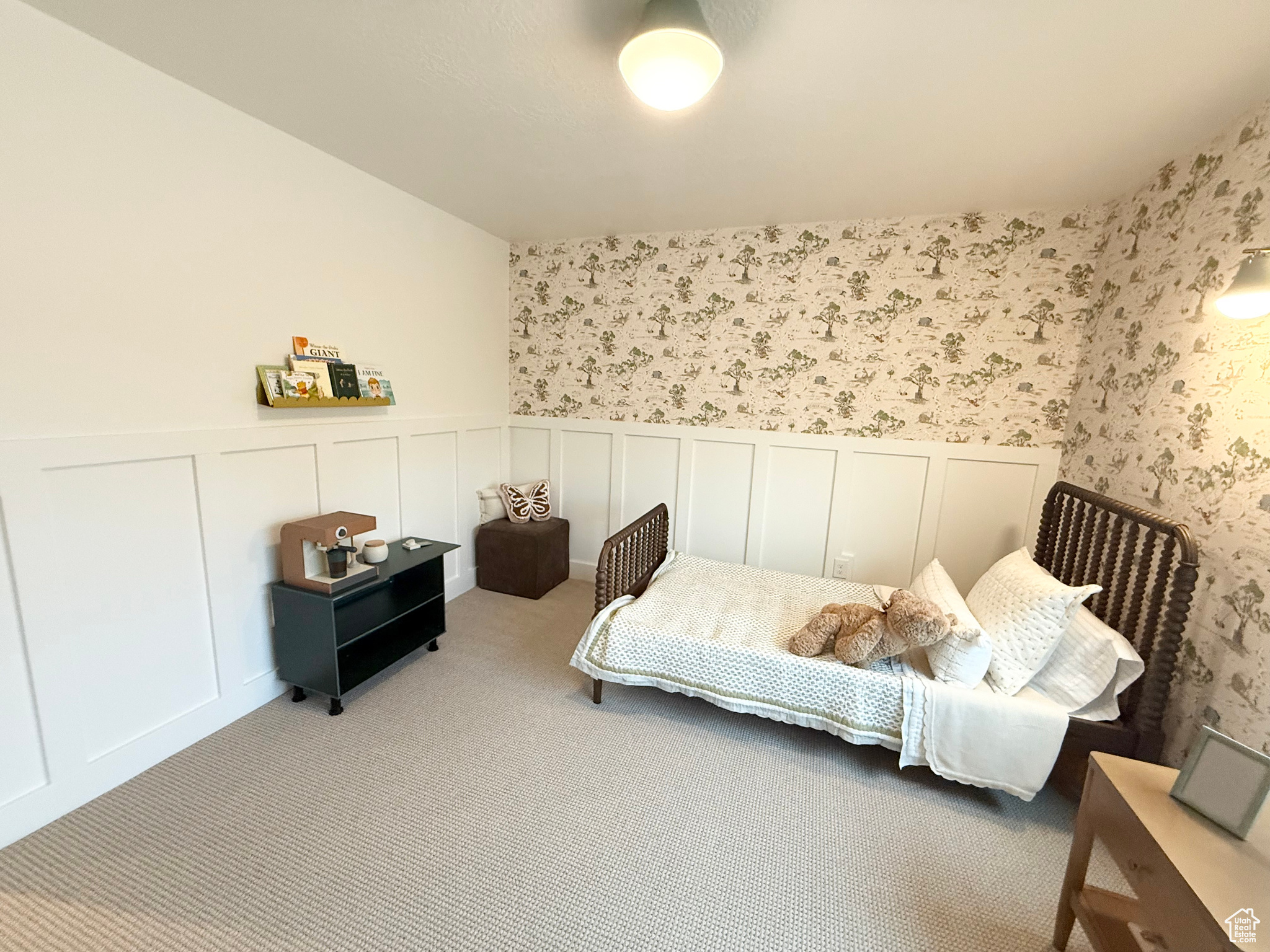 Bedroom featuring light colored carpet