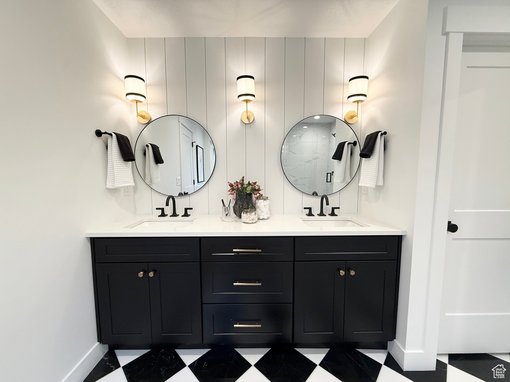 Bathroom featuring vanity and a shower