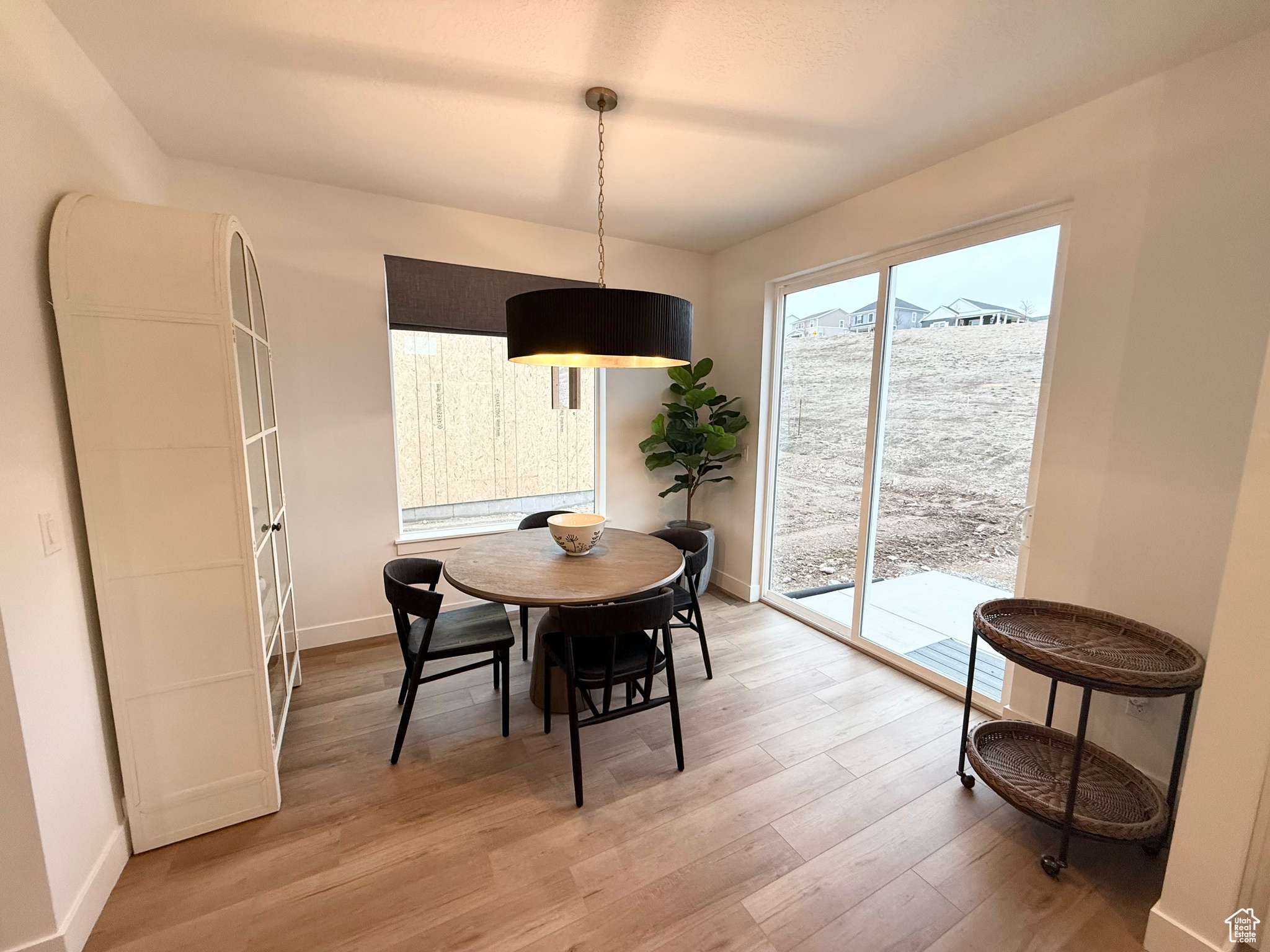 Dining area with light wood-type flooring