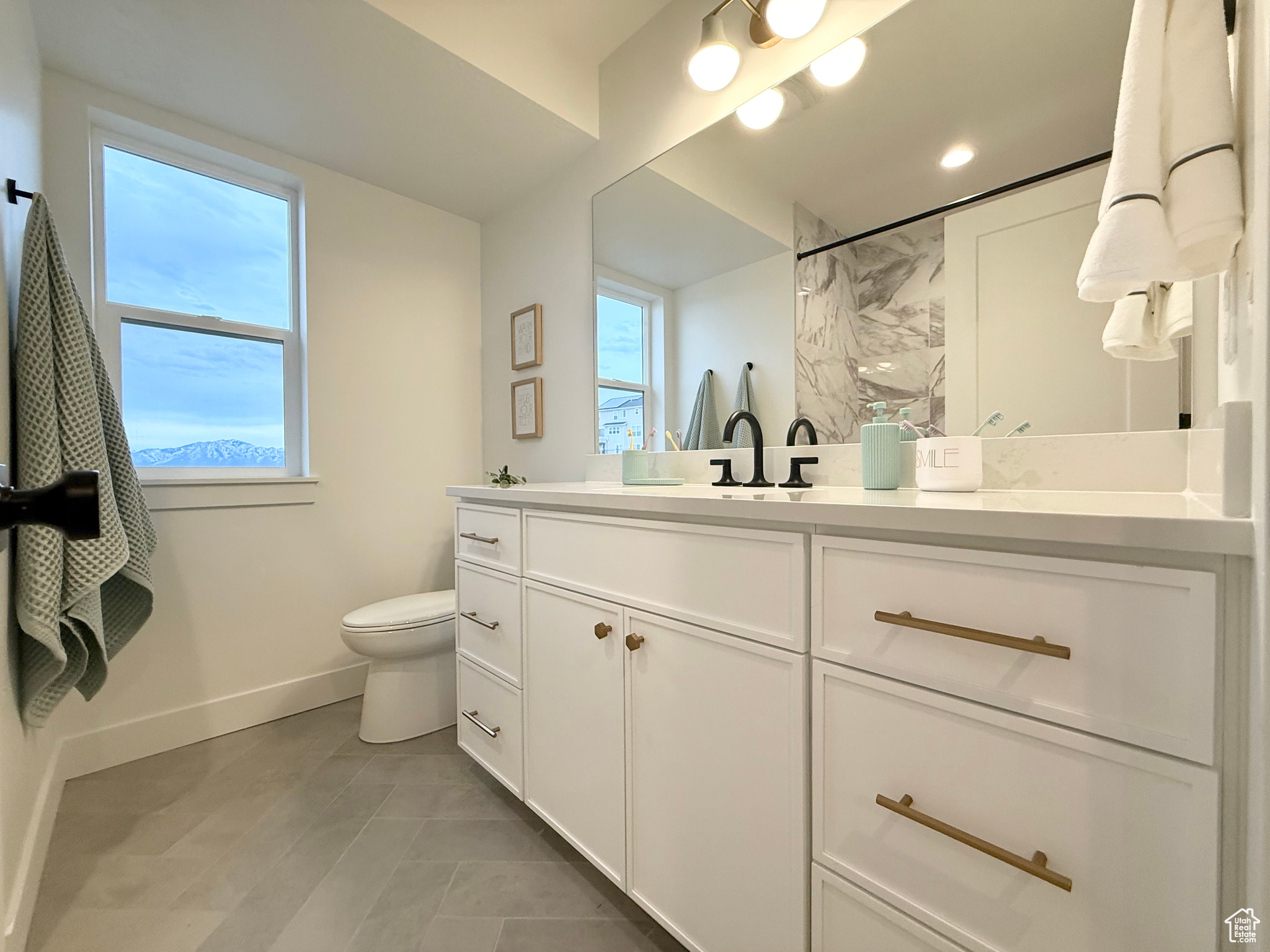 Bathroom featuring vanity and toilet